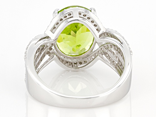 4.50ct Oval Manchurian Peridot™ With 0.57ctw Round White Zircon Rhodium Over Silver Ring - Size 6