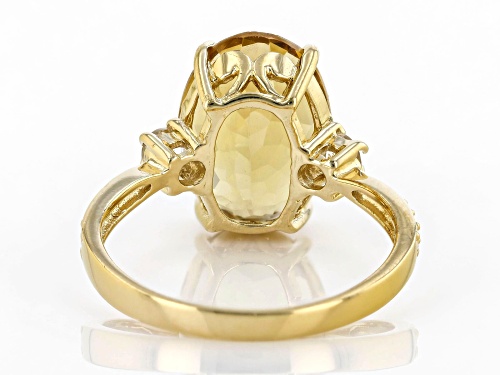6.00CT OVAL BRAZILIAN CITRINE WITH .50CTW ROUND WHITE TOPAZ 18K YELLOW GOLD OVER SILVER RING - Size 9