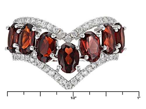 3.50ctw Oval Red Garnet With .67ctw Round White Zircon Rhodium Over Sterling Silver Chevron Ring - Size 7