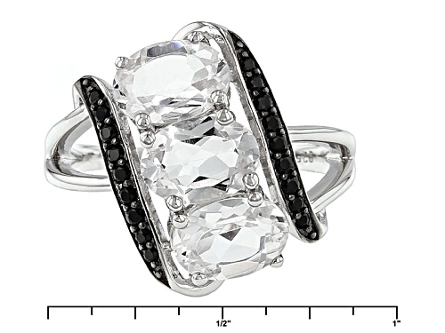 2.04ctw Oval Danburite And .17ctw Round Black Spinel Sterling Silver 3-Stone Ring - Size 7