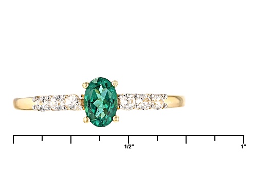 .45ct Oval Emerald Color Apatite And .28ctw Round White Zircon 10k Yellow Gold Ring - Size 7