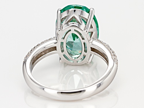 5.48CT OVAL LAB CREATED GREEN SPINEL WITH .37CTW WHITE ZIRCON RHODIUM OVER SILVER RING - Size 7
