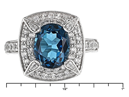 2.82ctw Oval London Blue Topaz With 1.21ctw Round White Zircon Sterling Silver Ring - Size 12