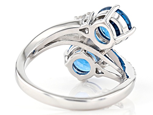 2.52ctw Round Lab Created Blue Spinel With .23ctw Zircon Rhodium Over Silver Bypass Ring - Size 6