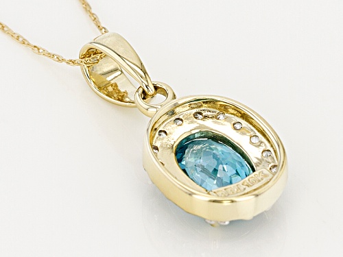 1.34ct Oval Blue Zircon With .12ctw Round White Zircon 10k Yellow Gold Pendant With Chain.