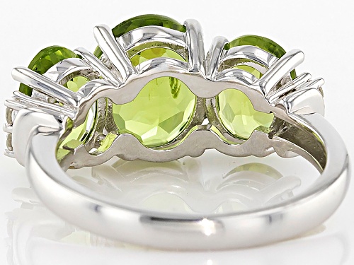 4.60ctw Oval Manchurian Peridot™ With .11ctw Round White Zircon Sterling Silver 3-Stone Ring - Size 5