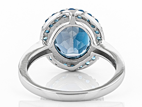 3.74ct Oval London Blue Topaz With .37ctw Round Neon Apatite Rhodium Over Silver Halo Ring - Size 8