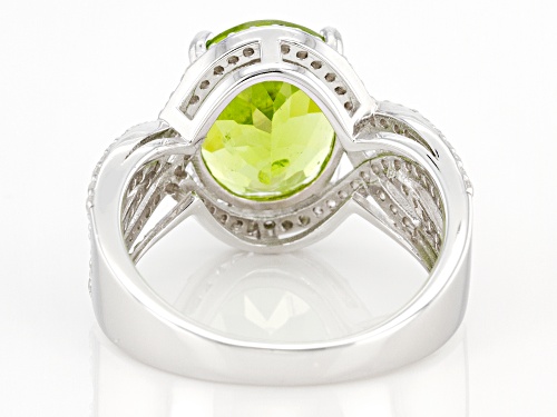 Pre-Owned 4.50ctw Oval Green Peridot With 0.57ctw Round White Zircon Rhodium Over Silver Ring - Size 8