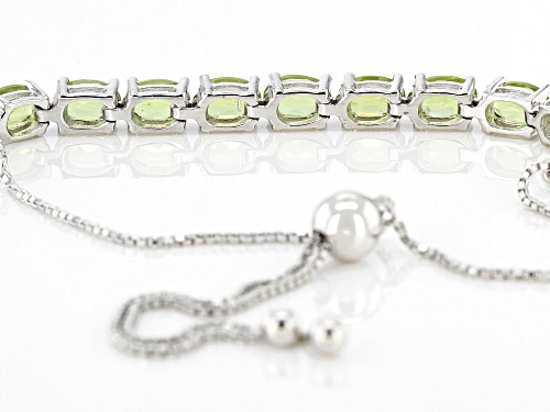 4.40ctw Oval Peridot Rhodium Over Silver Adjusts Approximately 6