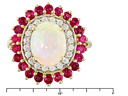 1.32ct Oval Ethiopian Opal With .85ctw Round Red Spinel And .36ctw White Zircon 10k Yellow Gold Ring - Size 12
