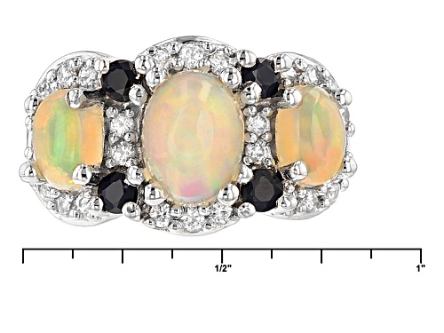 1.65ctw Oval Ethiopian Opal, .34ctw Blue Sapphire And .50ctw White Zircon Silver 3-Stone Ring - Size 8