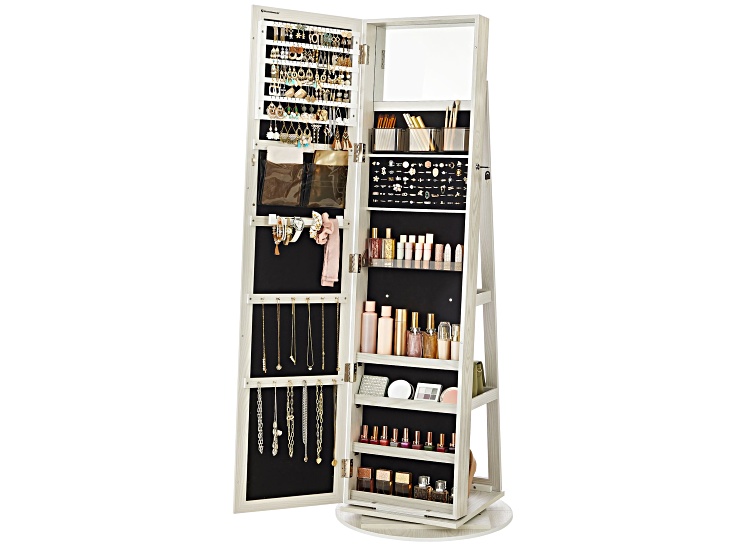 Tall jewelry armoire with open doors showing multiple compartments filled with jewelry and cosmetics