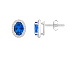 7x5mm Oval Created Sapphire And Created White Sapphire 10k White Gold Halo Stud Earrings