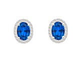 7x5mm Oval Created Sapphire And Created White Sapphire 10k White Gold Halo Stud Earrings
