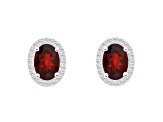 7x5mm Oval Garnet And Created White Sapphire 10k White Gold Halo Stud Earrings