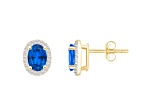 7x5mm Oval Created Sapphire And Created White Sapphire 10k Yellow Gold Halo Stud Earrings