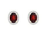 7x5mm Oval Garnet And Created White Sapphire 10k Yellow Gold Halo Stud Earrings