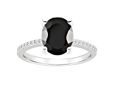 10x8mm Oval Black Onyx and 1/10 ctw Diamond Rhodium Over Sterling Silver Ring