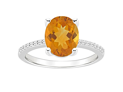 10x8mm Oval Citrine and 1/10 ctw Diamond Rhodium Over Sterling Silver Ring