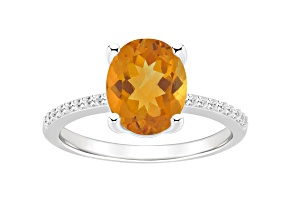 10x8mm Oval Citrine and 1/10 ctw Diamond Rhodium Over Sterling Silver Ring