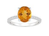 10x8mm Oval Citrine and 1/10 ctw Diamond Rhodium Over Sterling Silver Ring