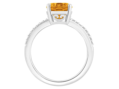 10x8mm Oval Citrine and 1/10 ctw Diamond Rhodium Over Sterling Silver Ring