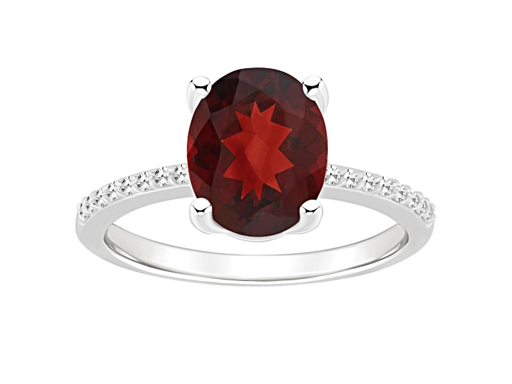 10x8mm Oval Garnet and 1/10 ctw Diamond Rhodium Over Sterling Silver Ring