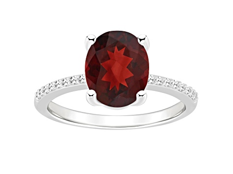 10x8mm Oval Garnet and 1/10 ctw Diamond Rhodium Over Sterling Silver Ring