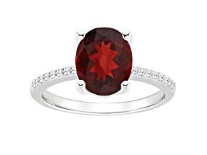 10x8mm Oval Garnet and 1/10 ctw Diamond Rhodium Over Sterling Silver Ring