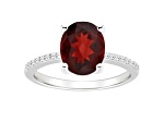 10x8mm Oval Garnet and 1/10 ctw Diamond Rhodium Over Sterling Silver Ring