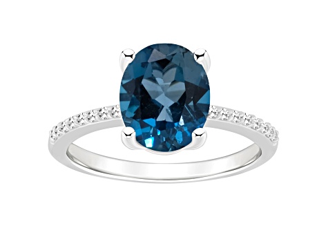 10x8mm Oval London Blue Topaz and 1/10 ctw Diamond Rhodium Over Sterling Silver Ring