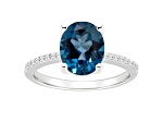 10x8mm Oval London Blue Topaz and 1/10 ctw Diamond Rhodium Over Sterling Silver Ring