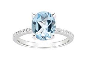 10x8mm Oval Sky Blue Topaz and 1/10 ctw Diamond Rhodium Over Sterling Silver Ring