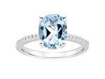 10x8mm Oval Sky Blue Topaz and 1/10 ctw Diamond Rhodium Over Sterling Silver Ring