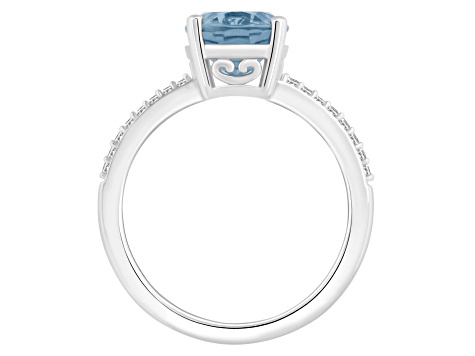 10x8mm Oval Sky Blue Topaz and 1/10 ctw Diamond Rhodium Over Sterling Silver Ring