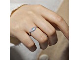 Blue Topaz with Moissanite Accents Rhodium Over Sterling Silver Evil Eye Halo Ring