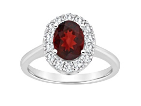 8x6mm Oval Garnet And White Topaz Accents Rhodium Over Sterling Silver Halo Ring