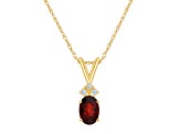 7x5mm Oval Garnet with Diamond Accents 14k Yellow Gold Pendant With Chain