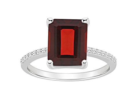 10x8mm Emerald Cut Garnet and 1/10 ctw Diamond Rhodium Over Sterling Silver Ring