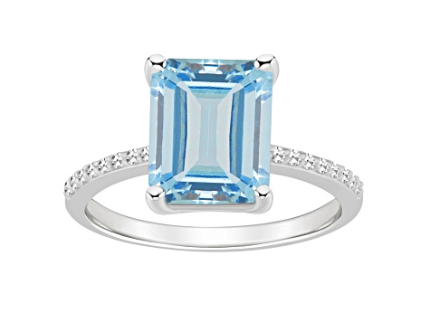 10x8mm Emerald Cut Sky Blue Topaz and 1/10 ctw Diamond Rhodium Over Sterling Silver Ring