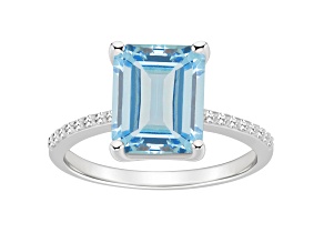 10x8mm Emerald Cut Sky Blue Topaz and 1/10 ctw Diamond Rhodium Over Sterling Silver Ring