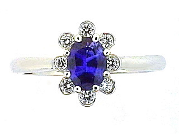 Oval Blue Sapphire and White Diamond Platinum Ring. 1.06 CTW