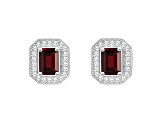 6x4mm Emerald Cut Garnet 1/5 ctw Diamond Rhodium Over Sterling Silver Halo Stud Earrings