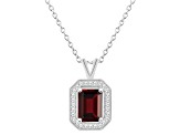 8x6mm Emerald Cut Garnet 1/7 ctw Diamond Rhodium Over Sterling Silver Halo Pendant with Chain