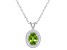 8x6mm Oval Peridot 1/8 ctw Diamond Rhodium Over Sterling Silver Halo Pendant with Chain