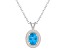 8x6mm Oval Blue Topaz 1/8 ctw Diamond Rhodium Over Sterling Silver Halo Pendant with Chain