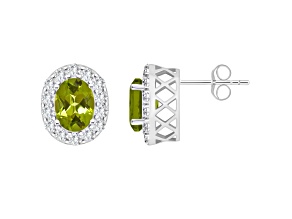 8x6mm Oval Peridot And White Topaz Accent Rhodium Over Sterling Silver Halo Stud Earrings