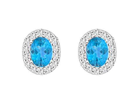 8x6mm Oval Swiss Blue Topaz And White Topaz Accent Rhodium Over Sterling Silver Halo Stud Earrings