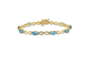 14k Yellow and White Gold with Rhodium Over 14k Yellow Gold Blue Topaz and Diamond Infinity Bracelet
