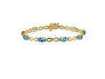 14k Yellow and White Gold with Rhodium Over 14k Yellow Gold Blue Topaz and Diamond Infinity Bracelet